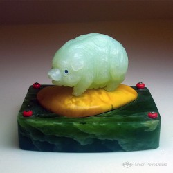 "Abundance" Pig in Jade from China, Amber and Jade from Siberia. Sculpture of fine stones. Glyptic. Front view