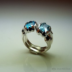 Ring in Argentium, Aquamarine and Topaz. Title: "Between two Seas", Arts and Crafts Jeweler. Lost wax in direct carving