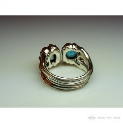 Ring in Argentium, Aquamarine and Topaz. Title: "Between two Seas", Arts and Crafts Jeweler. Lost wax in direct carving