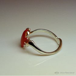 Ring in Argentium and red coral. Title: "Chtonic Wave", Arts and Crafts Jeweler. Lost wax in direct carving