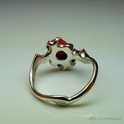 Ring in Argentium and red coral. Title: "Chtonic Wave", Arts and Crafts Jeweler. Lost wax in direct carving