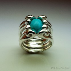 Ring in Argentium and turquoise. Title: "Treasure of the Seas", Arts and Crafts Jeweler. Lost wax in direct carving