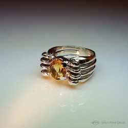 Ring in Argentium and Citrine. Title: "Gold Reflection", Arts and Crafts Jeweler. Lost wax in direct carving
