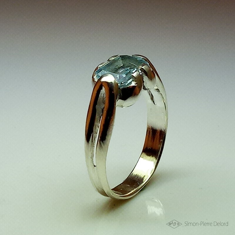 Ring in Argentium and aquamarine. Title: "Source of Life", Arts and Crafts Jeweler. Lost wax in direct carving