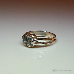 Ring in Argentium and aquamarine. Title: "Source of Life", Arts and Crafts Jeweler. Lost wax in direct carving